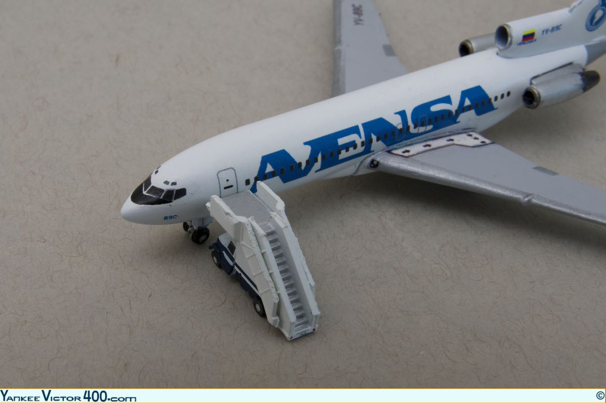 A GeminiJets air-stair attached to an Avensa 727 airplane model. A GeminiJets air-stair attached to an Avensa 727 airplane model.