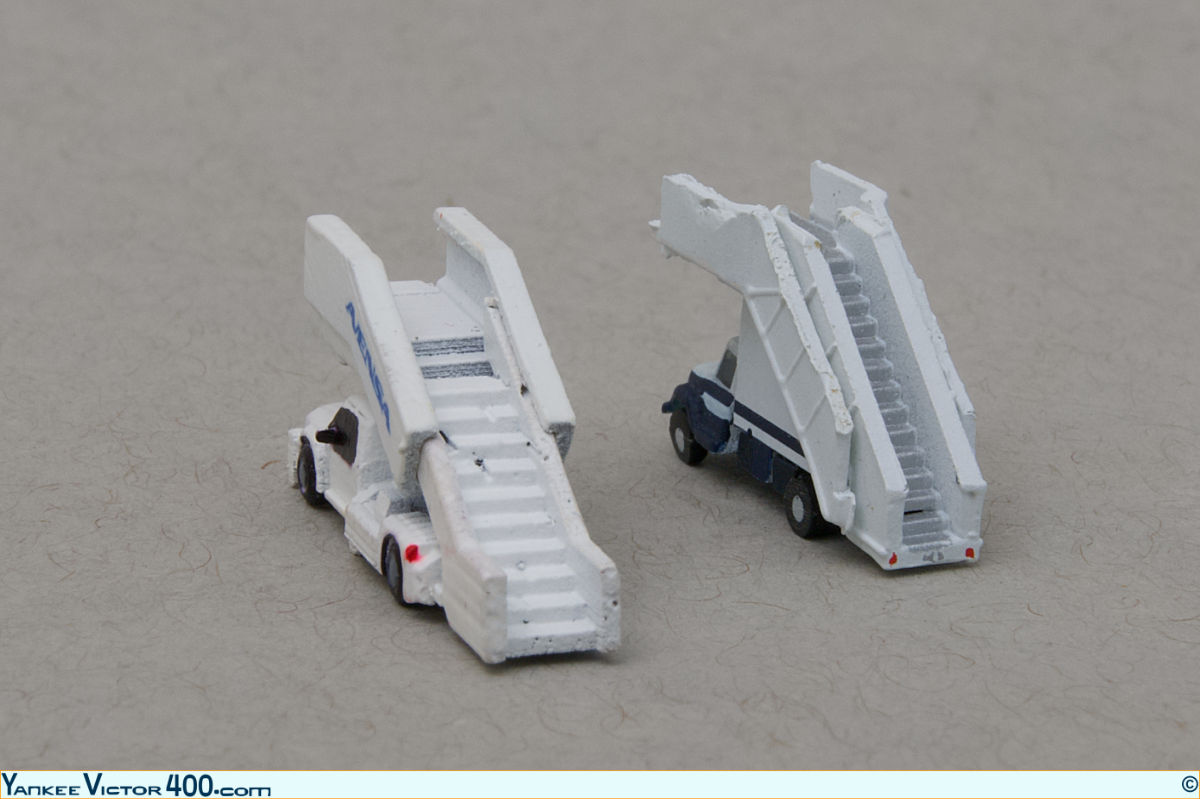 Two. set of air-stairs in 1:400 scale, one made by West Coast Diecast, and the other one by GeminiJets. Two. set of air-stairs in 1:400 scale, one made by West Coast Diecast, and the other one by GeminiJets.