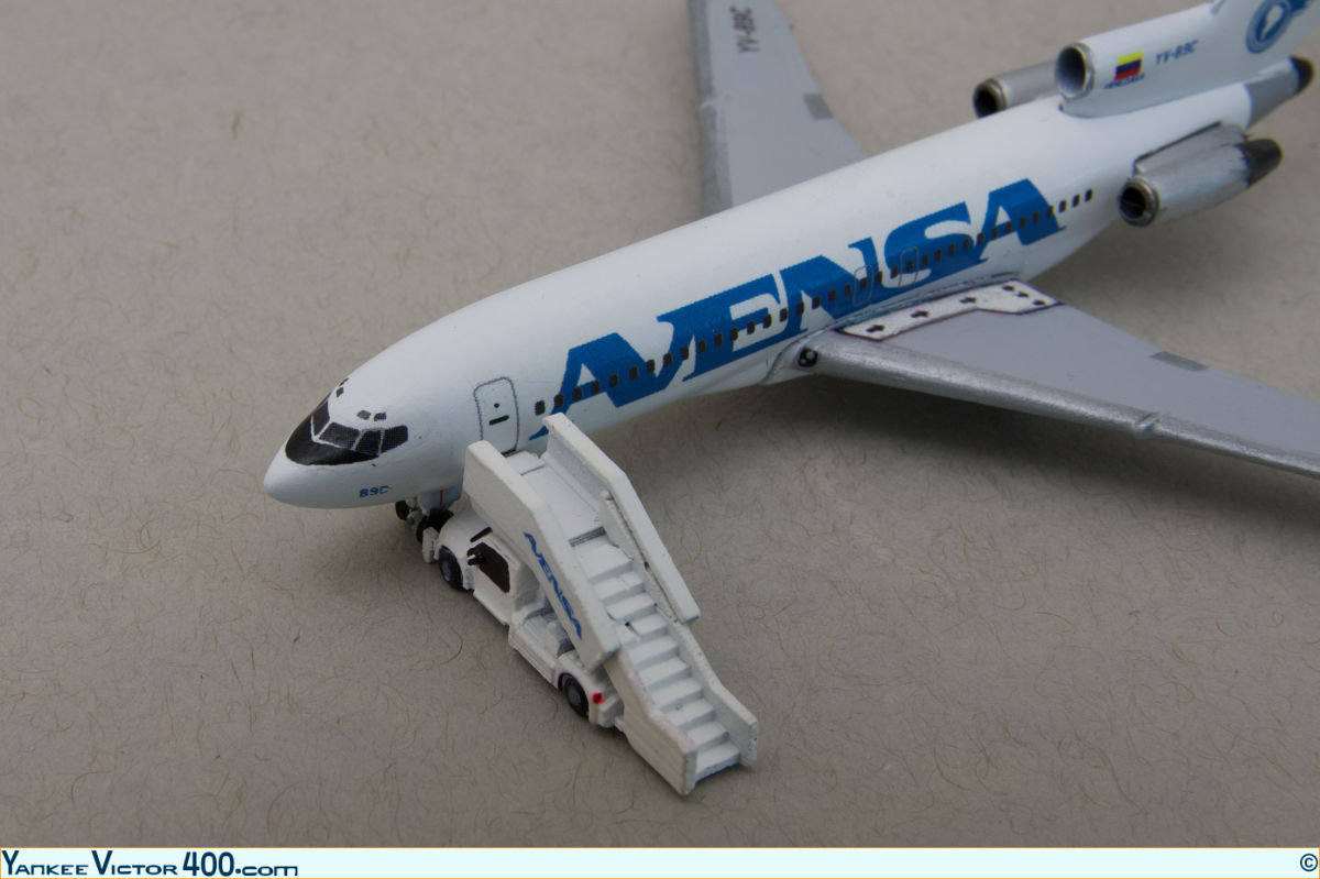 A West Coast Diecast air-stair attached to an Avensa 727 airplane model.
