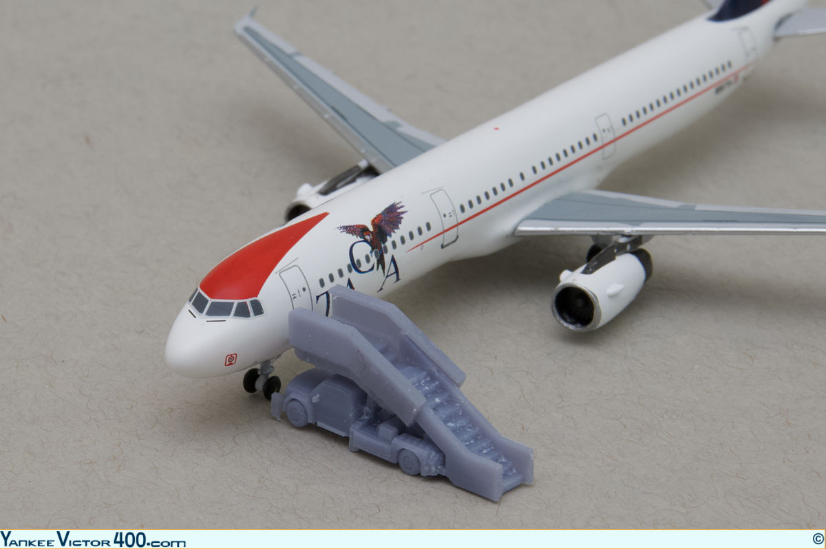 A narrow-body air-stair truck fitted to a TACA Airbus A321 aircraft model. A narrow-body air-stair truck fitted to a TACA Airbus A321 aircraft model.