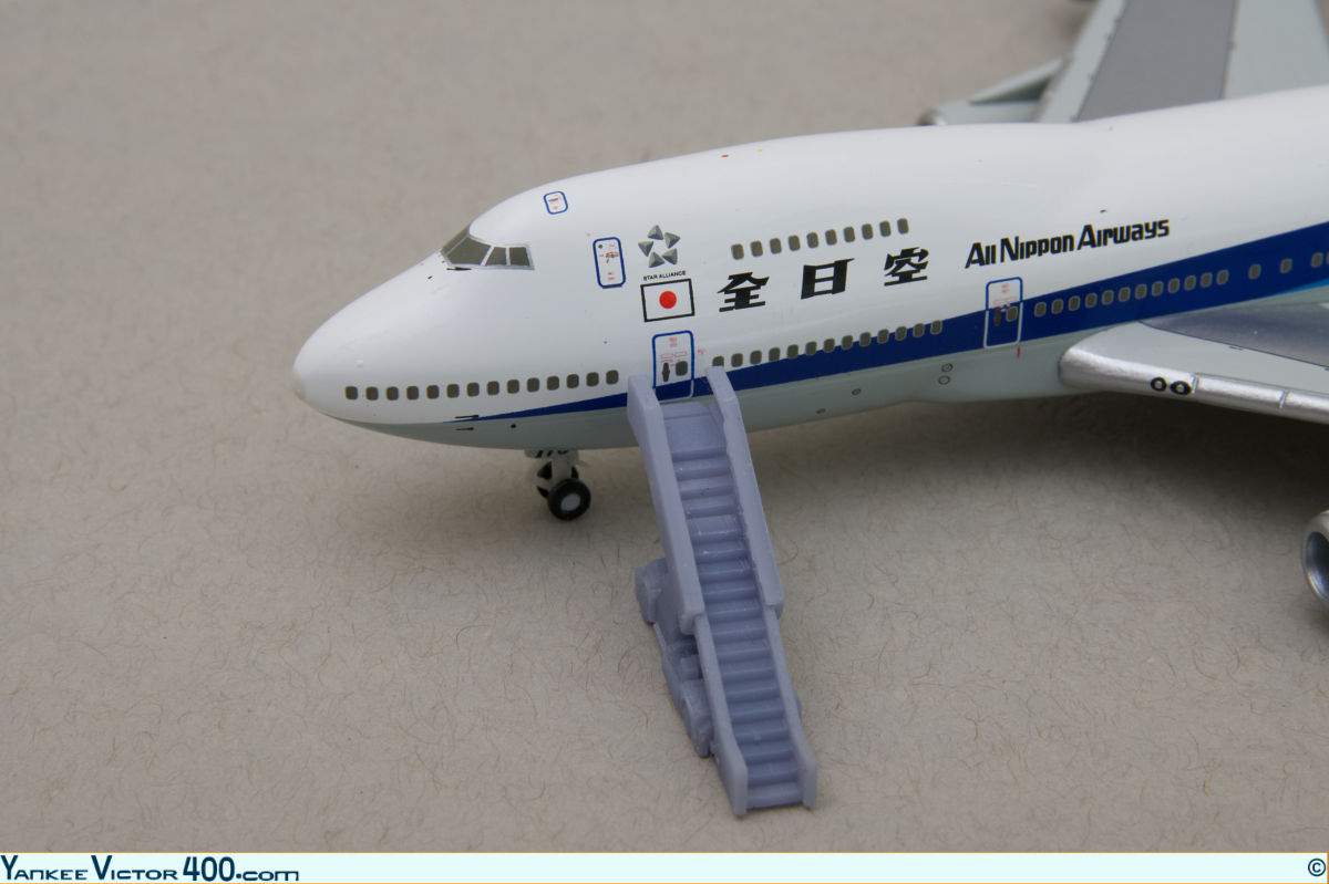 Wide-body aircraft air-stairs fitted to an All Nippon Airways 747 aircraft model. Wide-body aircraft air-stairs fitted to an All Nippon Airways 747 aircraft model.